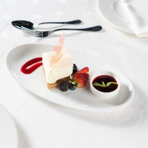 Cheesecake with Raspberry Sauce, Fresh Fruit and Berries